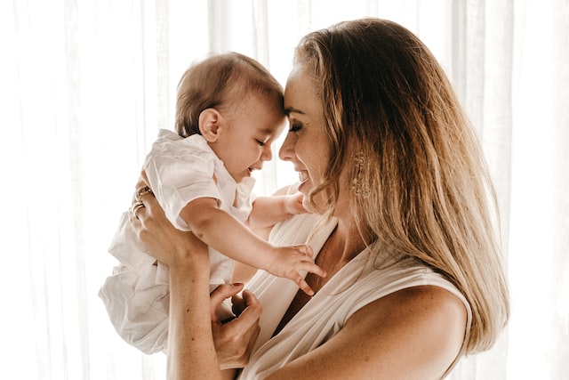 person holding the baby