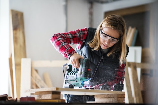 person using electrical jigsaw