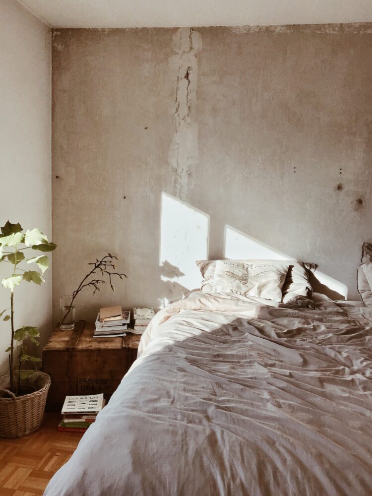 white bed in the light room