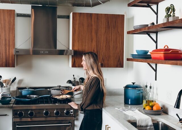 woman holding brown spatula